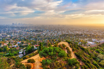 Stunning Sunset Over Los Angeles with Hikers Enjoying the View