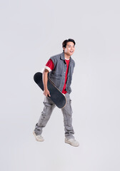 Portrait of asian man playing skateboard on white background