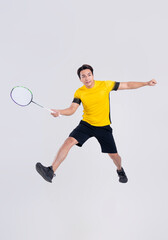 Portrait of Asian man playing badminton on white background.