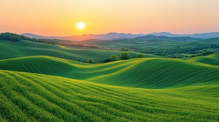 Serene sunset over rolling green hills with distant mountains and soft light in the background