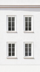 Fototapeta premium Classic White Building Exterior with Four Paned Windows Architectural Detail Sunlight