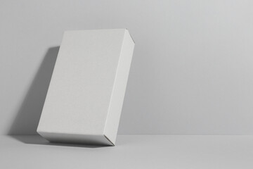 One blank cardboard box on white background. Mockup for design