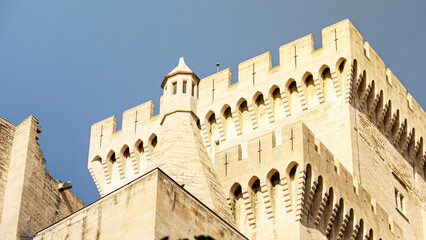Tower with battlement and fortified wall of the Palais des Papes in Avignon, France