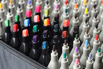 Many colorful markers in bag, closeup. Art supplies © New Africa