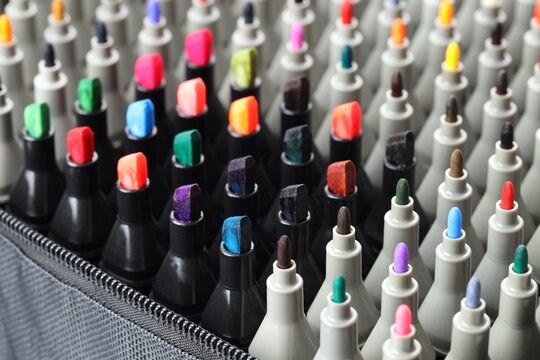 Many colorful markers in bag, closeup. Art supplies