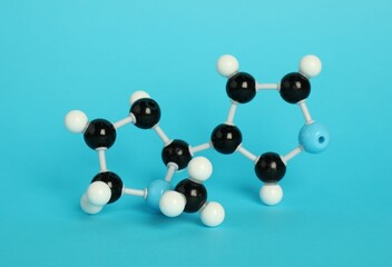 Chemical model of molecule on light blue background