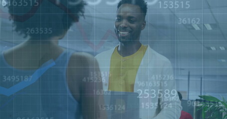 Image of financial data processing over diverse business people in office