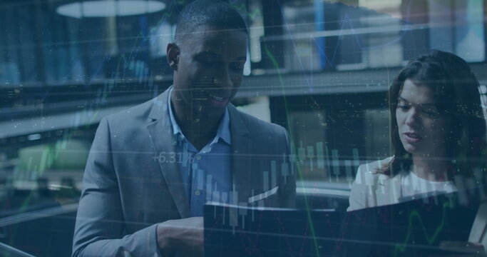 Image of financial data processing over diverse business people in office