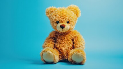 Adorable plush teddy bear sitting against a vibrant blue background, evoking warmth and nostalgia
