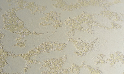 Venetian, textured plaster, warm yellow grooved relief, creates the effect of a worn wall