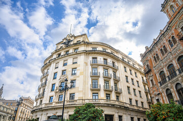 Facade of the building La Union y El Fenix, Seville, Spain.