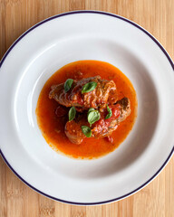stuffed and cooked steak in tomato sauce