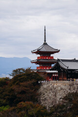 Naklejka premium Kiyomizu-dera buddhist temple in Kyoto prefecture, Japan, Higashiyama ward, autumn fall view with mountains, Kyoto streets and skyline, shrine and pagoda, travel to Japan, Kansai region