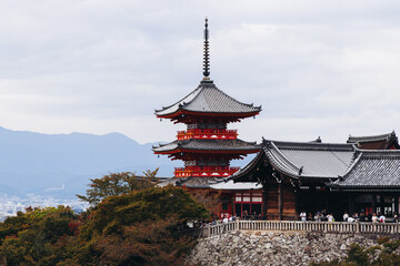 Kiyomizu-dera buddhist temple in Kyoto prefecture, Japan, Higashiyama ward, autumn fall view with mountains, Kyoto streets and skyline, shrine and pagoda, travel to Japan, Kansai region