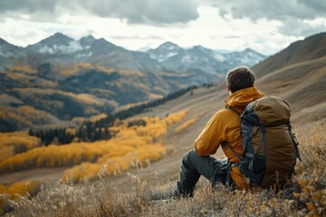 Man on hill with backpack