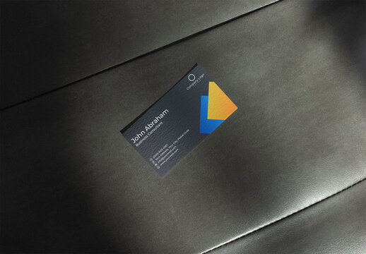 US size Business Card Template Placed on Textured Black Surface. Rough texture