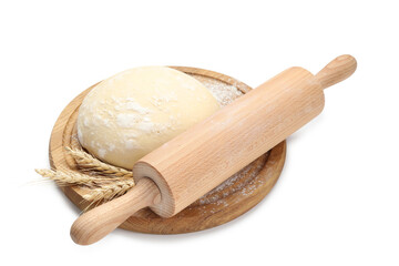 Rolling pin, dough and spikes isolated on white