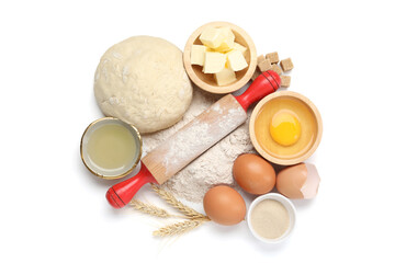 Rolling pin and different ingredients isolated on white, top view