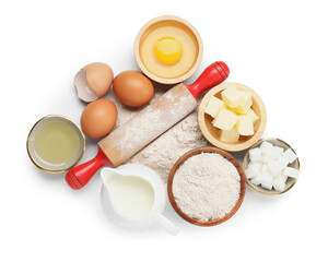 Rolling pin and different ingredients isolated on white, top view