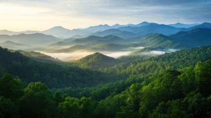 Fototapeta premium Lush green mountains stretch into horizon, enveloped in soft mis