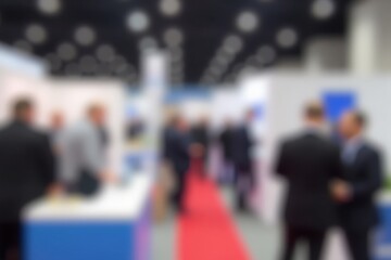 Obraz premium Busy Conference Hall with Professionals Engaged in Networking and Discussions, Highlighting Diverse Business Attire and Event Atmosphere