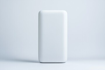 Sleek white power bank stands against minimalist backdrop, showc