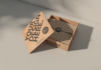 Wooden box mockup with open lid and wrapping paper