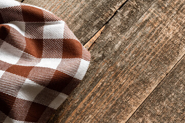 A kitchen napkin on an old wooden table