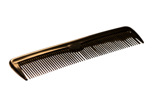 Close-up shot of an orange hair comb on a contrasting dark background