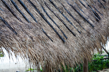 Roof from dried leaves of the nipa palm close up background