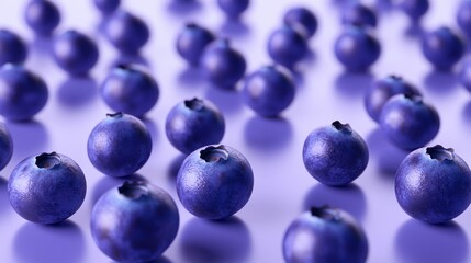 Fototapeta premium A group of perfectly round blueberries scattered in a random pattern on a transparent surface. 