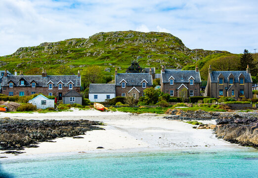 View into land of a row of houses by the beach, Iona, Inner Hebrides, Scotland, UK