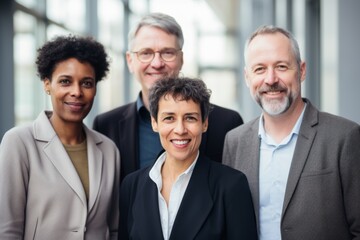 Obraz premium Group of middle aged diverse business people in modern office