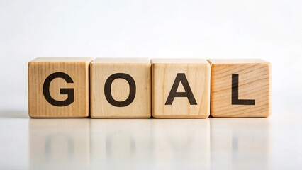 Word GOAL made from wooden blocks on white background
