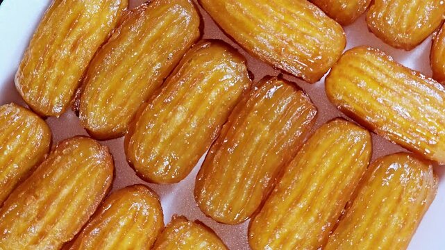 Balah el Sham or Egyptian Choux Pastry, very popular Ramadan month dessert in Egypt and middle east, crispy and tender choux pastry deeply fried and coated in sweet simple sugar syrup, served cold
