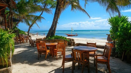 A casual beach caf with round wooden tables and comfortable chairs set up on a sunny beach terrace.