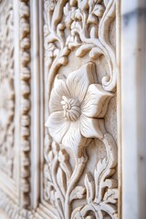 A close-up of intricate marble carvings on the Taj Mahal walls