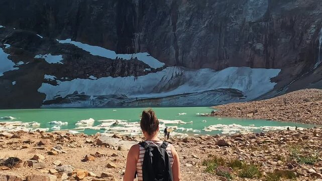 Woman walking towards Angel Glacier in the Edith Cavell area of Jasper National Park, Alberta