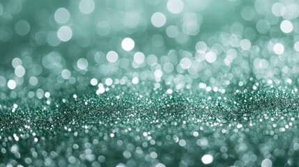 Obraz premium Green bokeh background. Beautiful green background with glitter and blurred and focal lights. Depth of field sparkling blue and green bokeh with light effects.