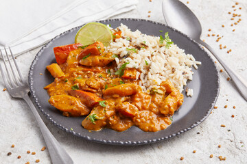 Salsify Curry with Rice on a black plate