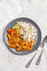 Salsify Curry with Rice on a black plate