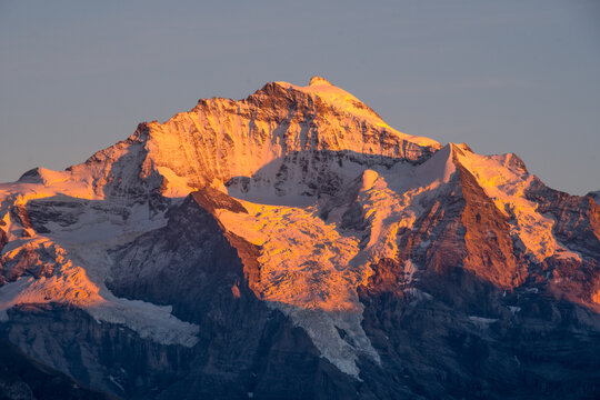sunset over snowy mountains - Powered by Adobe