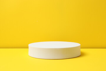 White podium on yellow background