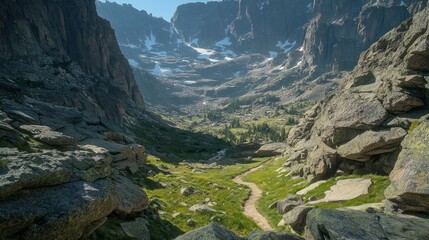 Obraz premium Mountain Trail Winding Through Rocky Alpine Valley