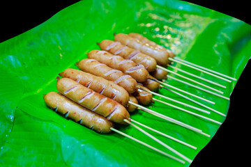 Top view of Isan Sausage on banana leaf, focus selective