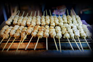 Top view of Pork meatballs grill on a charcoal stove, focus selective