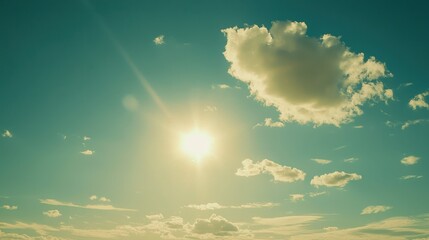 Bright Sunlight Shining Through Clouds Under Blue Sky at Dusk