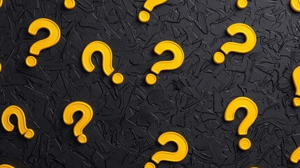 Yellow question marks on textured black background