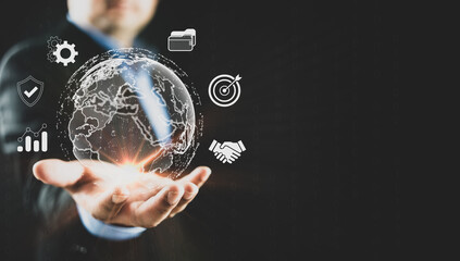 Businessman holding globe with business icon. Business global internet connection application technology and digital marketing, Financial and banking, Digital link tech, big data, business target.