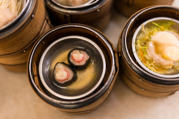 Close up of dim sum dim sum in bamboo steamers at the restaurant